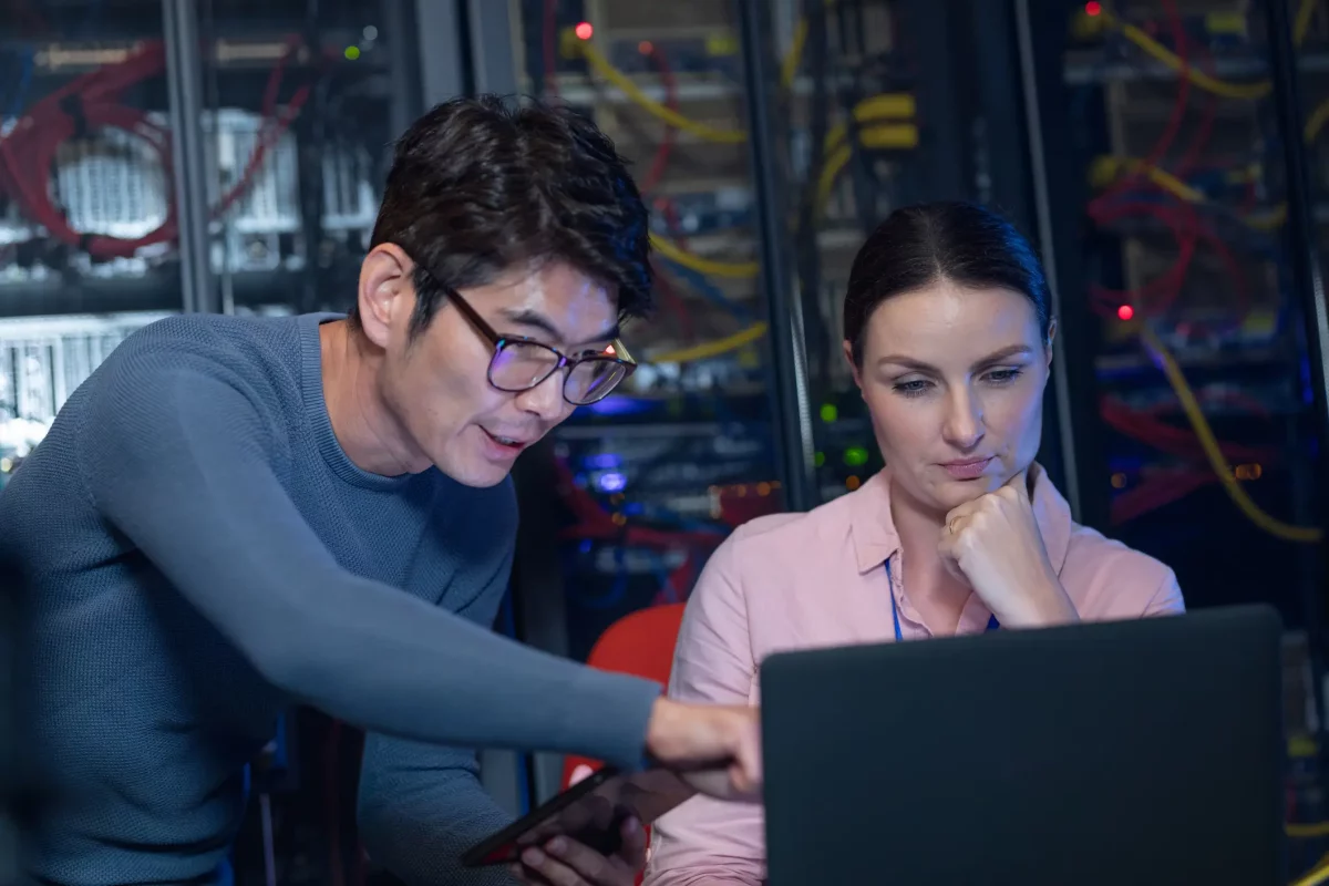 A picture of two IT workers for IT Service Management in Louisiana, looking at a computer.